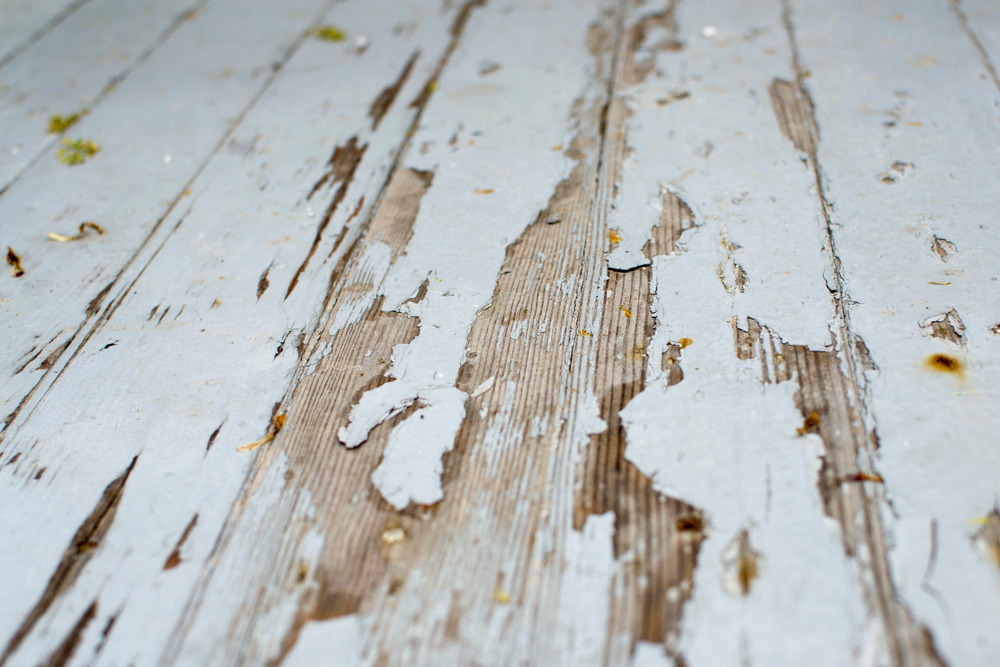 chipping paint on wood deck panels